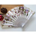 Traditional floral print folding fan with gold lace edge and white plastic frame - No. 2 White