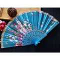 Elegant blue floral folding fan featuring durable plastic ribs and delicate gold lace trim - No. 4 Lake Blue