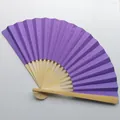 Detailed view of a purple candy-colored folding fan with natural bamboo frame ribs - Purple