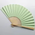 Detail view of a 9-inch light green blank folding fan for wedding decor - Light Green