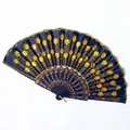 Detail view of blue folding fan with golden sequin peacock feather embroidery - 23CM*42CM / Black Ribs Yellow Sequin