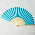 Detailed close-up showing the vibrant blue paper folding fan with decorative carved bamboo ribs. - Lake Blue