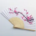 Detail of 21cm Chinese bamboo folding fan with pink plum blossom pattern on white surface. - Style 20 Plum Blossom Silk Fan