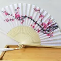 Traditional white silk folding fan featuring an elegant pink plum blossom print design - Folding Fan / Pink Plum Blossom (Metal Fastener)
