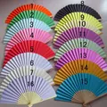 Selection of 16 vibrant colored folding paper fans for DIY wedding party decorations - Multicolor