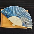 Close-up of 21cm bamboo folding fan featuring Monet Impression Sunrise oil painting. - Ink Landscape / 21cm