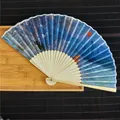 Detailed view of elegant bamboo folding fan featuring Impression Sunrise oil painting print - Impression Sunrise / 21cm