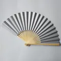 Detailed view of silver paper folding fan with natural bamboo ribs - 23cm / Silver