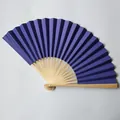 Close-up view of a high-grade 23cm deep purple paper fan with natural bamboo ribs - 23cm / Deep purple