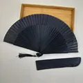 Elegant black Chinese folding fan with silk tassel and a matching protective storage pouch - Erqing Black Large Fan with Pouch / Solid Black