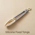 Durable food-grade silicone kitchen tongs with stainless steel handle in elegant cream white color - White 7-Inch Food Tongs