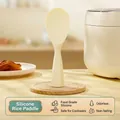 Standing silicone rice scoop in cream white finish with non-stick surface and ergonomic base - Standing / Beige