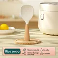Standing white silicone rice paddle with non-stick surface and natural wooden handle - Standing Beech Wood Nobby Style