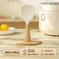 Standing silicone rice paddle with non-stick texture and ergonomic wooden handle base - Beechwood Handle / White