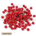 Detailed view of mini red artificial berries with 1.5cm diameter and 7cm wire stem - 1.5cm / Red