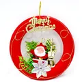 Close-up of a red festive Christmas wreath with Santa Claus and golden Merry Christmas text - Santa Claus Hanging Ring