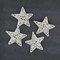 Detailed view of four white hollowed-out star Christmas ornaments on a dark background. - 8cm 4 Pieces/Pack / White