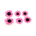 Detailed macro view of six vibrant pink wooden sunflower heads for DIY craft accessories. - 10 Pieces/Pack / Pink