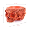 Detailed macro view of red resin skull planter showing dimensions 16.5cm x 12.5cm x 9cm - Orange Red Biomechanical Skull (H8164) / H8164