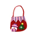 Detailed view of red Christmas gift bag featuring cute snowman and glittery tree patches - Snowman Style