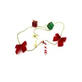 Detail of Christmas tree garland with red bows, candy canes, and gift box ornaments - Candy Cane Style