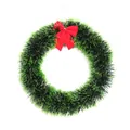 Detailed macro view of 30cm green tinsel Christmas wreath with a bright red bow - 30cm Diameter / Green Edge