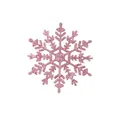 Detailopname van een roze glitterende plastic sneeuwvlok ornament voor kerstboomdecoratie - Roze