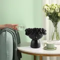 Nordic creative face art flower pot in matte black placed on a modern coffee table - Matte Black
