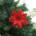 Close-up of red artificial Poinsettia flower with glitter on a Christmas tree - Red
