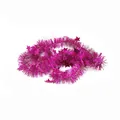 Close-up detail of magenta Christmas tinsel garland with sparkling star sequin accents - Rose Red