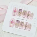 Faux ongles faits main rose avec des gemmes en cœur et des motifs d'étoiles dorées - S / Taozhi (CD020)