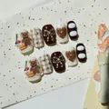 Detailed view of handmade press-on nails with cute 3D bear and chestnut cake designs - S / Chestnut Cake