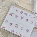 Detail view of luxury strawberry and grape shaped nail art jewelry in a clear case - MD037 (Fruit Mix Rhinestone Style)