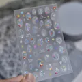 Close-up of holographic jelly shell light nail stickers with ocean fish patterns. - Ice Clear Blue - Ocean Series (TO 5787)