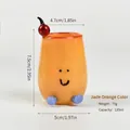 Niedliche orangefarbene Cartoon-Glastasse mit Smiley und Kirschdekor für den Schreibtisch - Orange Jade
