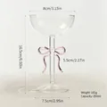 Elegant champagne coupe glass with a decorative pink glass bow stem and 250ml capacity - Cocktail Glass / Pink