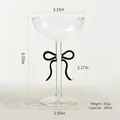 Elegant glass champagne flute featuring a black bow design with 250ml capacity and dimensions - Cocktail Glass / Black