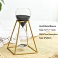 Nordic style decorative hourglass timer with golden metal frame and black sand - Black