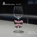 Elegant 320ml borosilicate glass wine goblet featuring a pink bow tie stem decoration. - 320ml / Pink Bow Red Wine Glass Style A