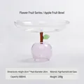 Kreative Glas-Obstschale in Apfelform mit einem rosa Sockel und grünen Blättern - Rosa Apfel