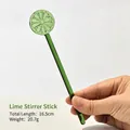 Green translucent glass stirring rod featuring a lime slice design, total length 16.5cm - Lemon Stirring Rod / Length 16.5cm / Green