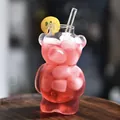 Cute bear-shaped glass cup for creative cocktails and cold drinks at home or bars. - With Straw