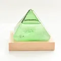 Green pyramid storm glass weather predictor on light wood base for desktop decor - Green Pyramid Storm Glass + Luminous Base