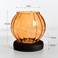 Elegant vintage amber ribbed glass candle holder with black wooden base 9.5cm height - Striped / Champagne