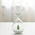 Creative glass Christmas hourglass timer featuring a miniature tree and fine white sand - Christmas Tree / 30 Minutes