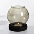 European style round smoke grey glass candle holder with dark wood base and lit tea light - Round Style / Gray