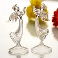 Detailed view of two elegant clear glass angel figurines playing musical instruments. - ts043 Transparent / Clear