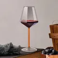 Diamond-shaped crystal wine glass with a unique orange stem on a rustic table - Orange Stem (BZ051)