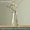 Minimalist bird-shaped ribbed glass vase for Japanese Zen home decor, transparent finish - Striped Bird Song Bottle