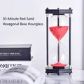 Reloj de arena decorativo de 30 minutos con arena roja y marco hexagonal negro - Marco de Madera Arena Roja / Temporizador 30 Minutos
